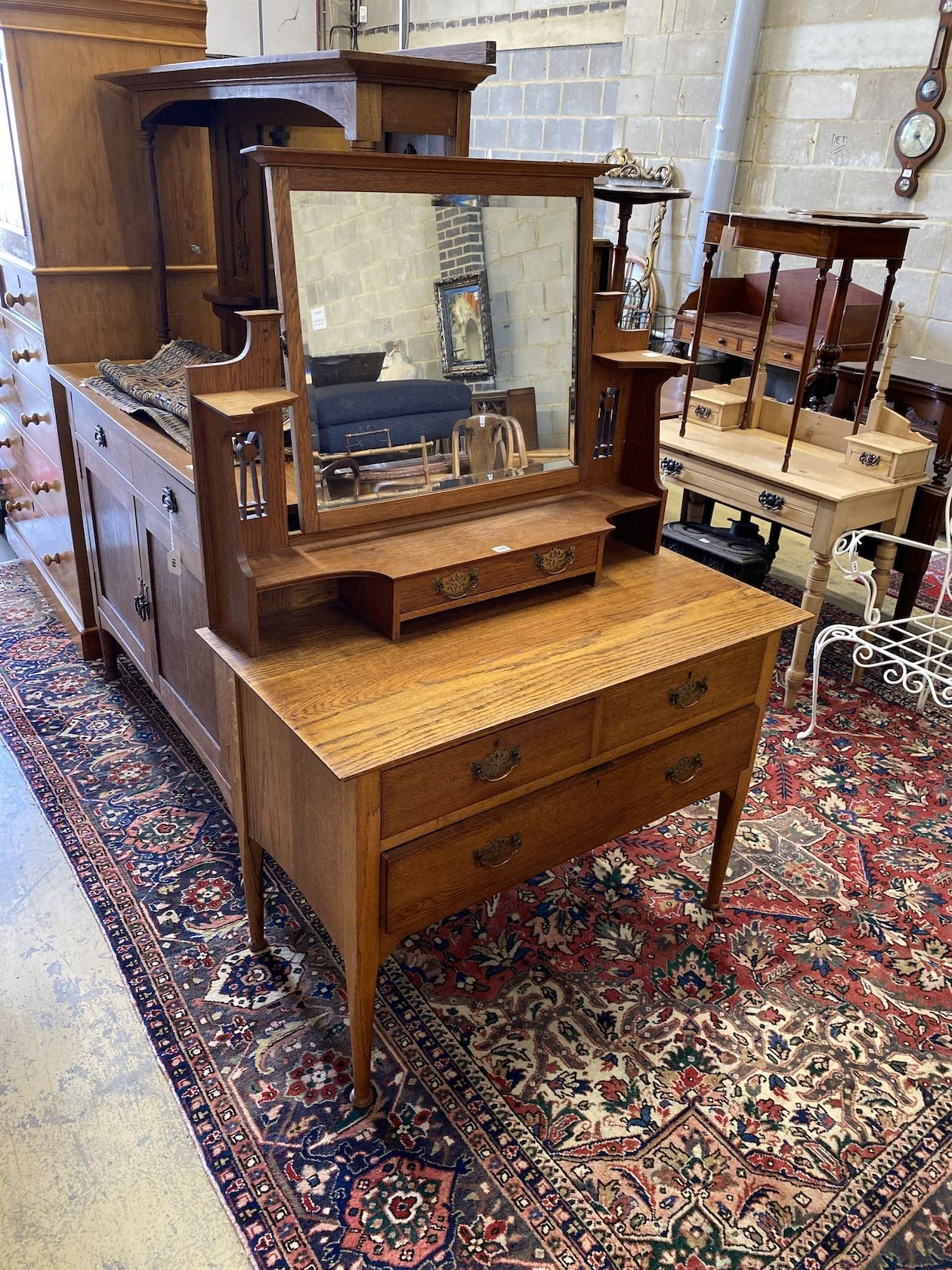 An early 20th century Art Nouveau oak dressing table, width 107cm, depth 54cm, height 155cm